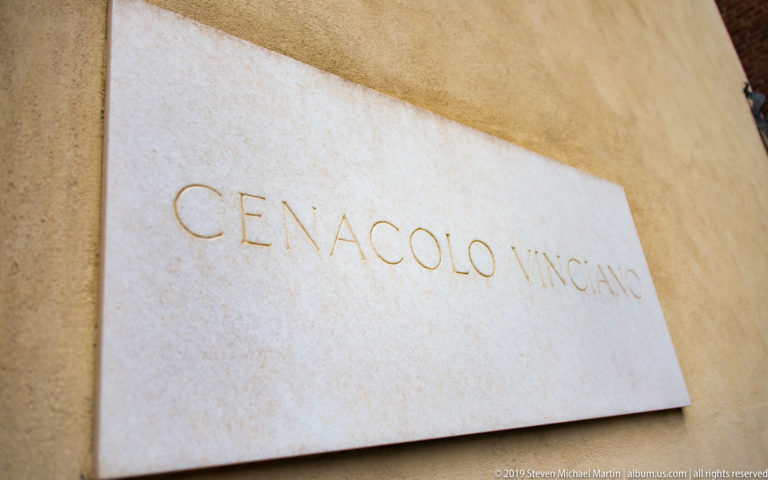 Pale stone wall plaque engraved CENACOLO VINCIANO on the exterior of the museum complex.
