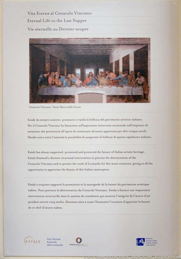 Conservation panel with a reproduction of The Last Supper, explanatory text, and institutional logos discussing preventive protection of the mural.