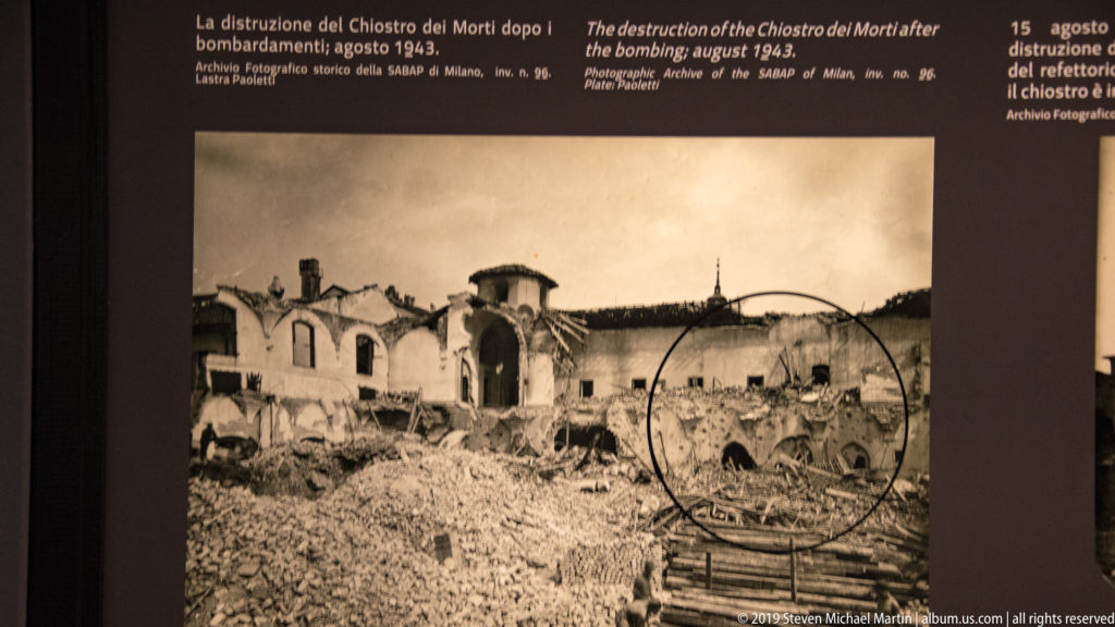 Archival 1943 view of the destroyed Chiostro dei Morti with rubble, collapsed roofs, and a circled surviving section.