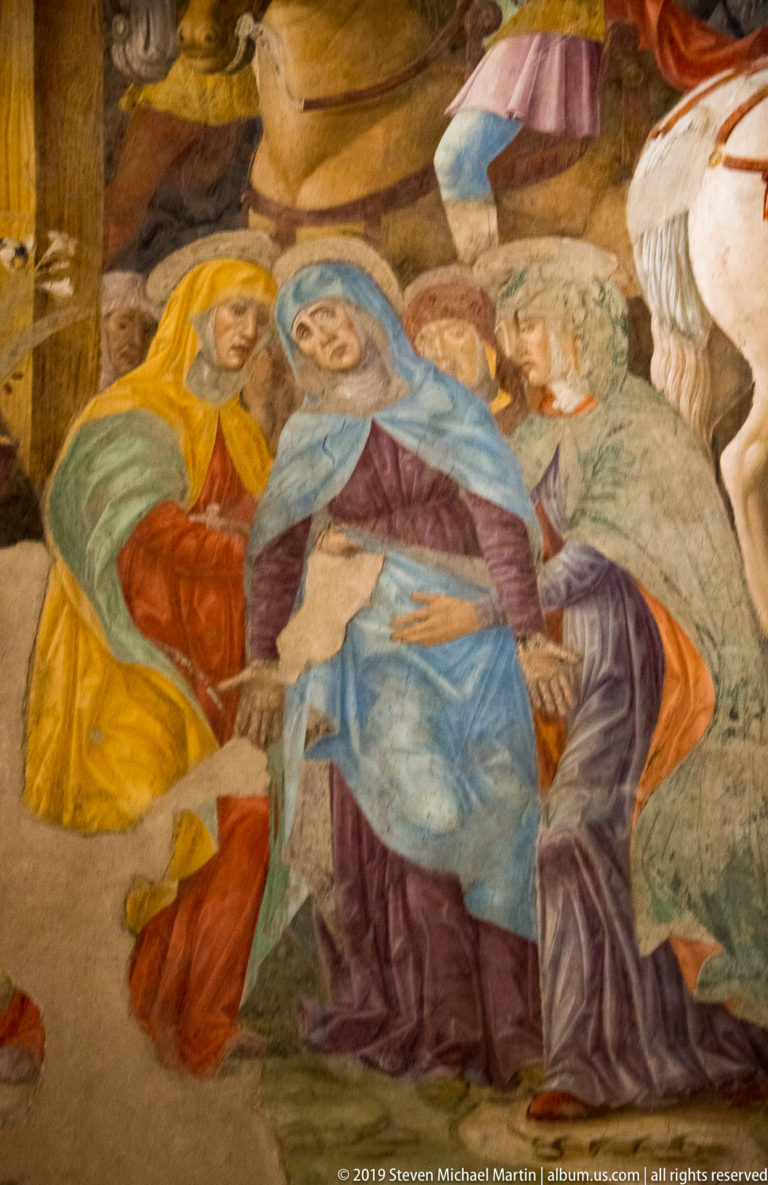 Mourning women in brightly colored robes support a central blue-clad figure beneath Montorfano’s Crucifixion.