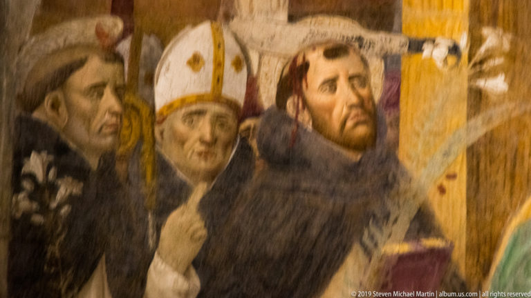 Dark-hooded friar, mitred prelate, and bearded Dominican figure in a close detail of Montorfano’s Crucifixion.