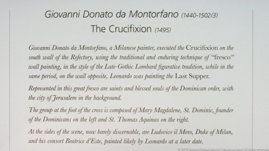 English museum label identifying Donato Montorfano’s 1495 Crucifixion and describing its technique, figures, Jerusalem background, and donor portraits.