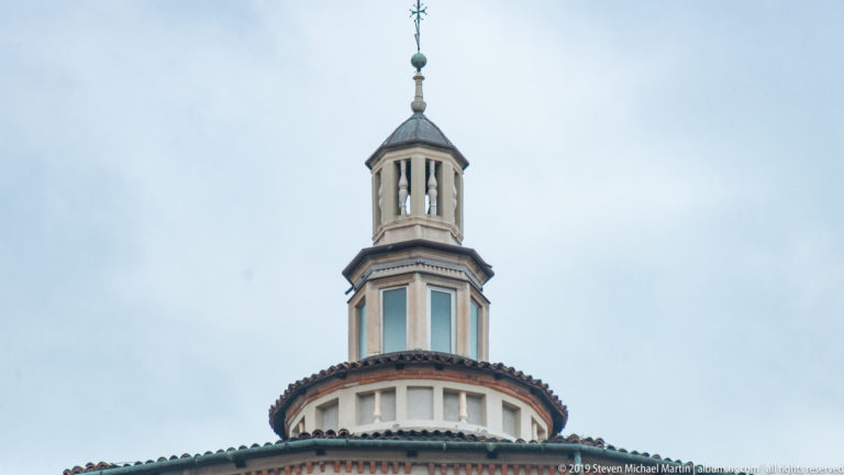 Upper lantern of Santa Maria delle Grazie with open columns, smaller upper stage, domed cap, and metal finial.