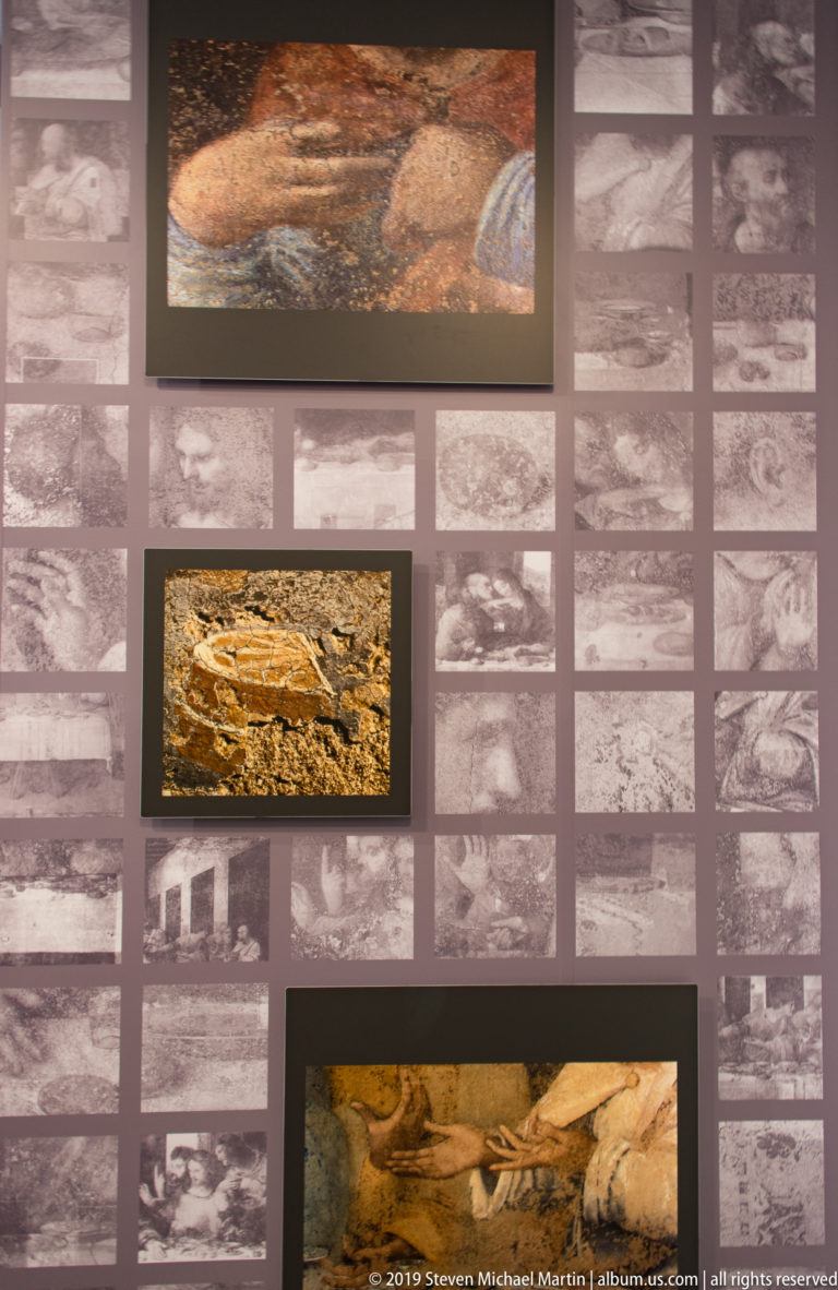 Conservation display with several enlarged color fragments of The Last Supper over a grid of smaller monochrome technical images.