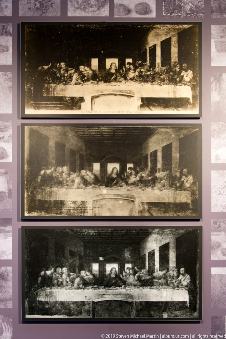 Three stacked black-and-white historical reproductions of The Last Supper displayed for comparison in the Cenacolo Vinciano.