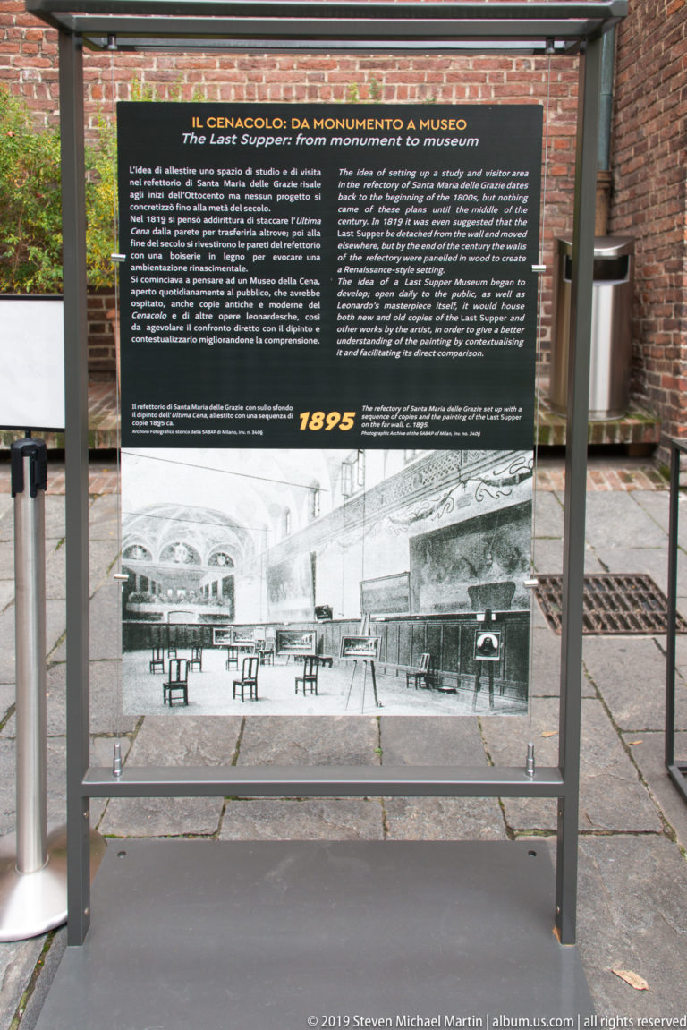 Freestanding bilingual museum panel headed Cenacolo: da monumento a museo, dated 1895, with a large historical refectory photograph.