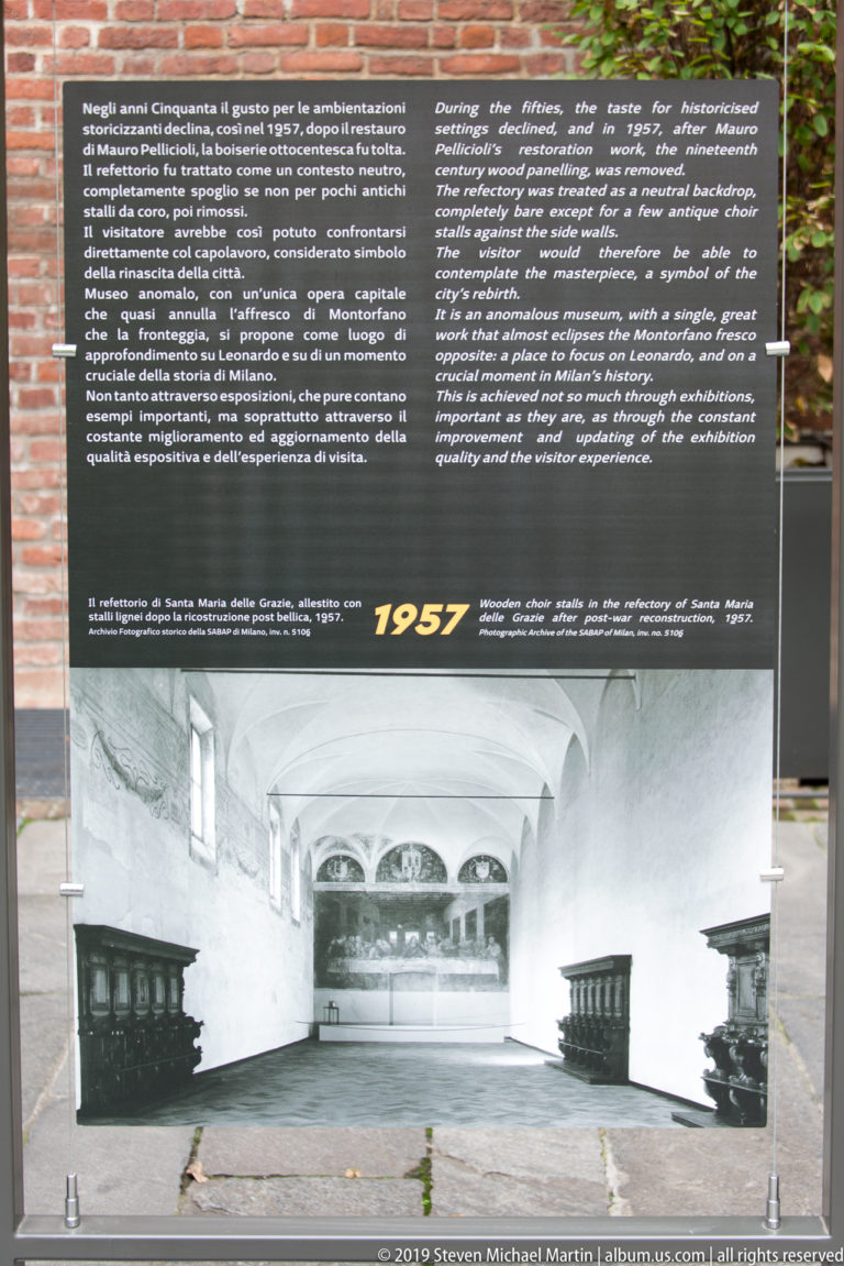Museum interpretation panel marked 1957, with bilingual text above a black-and-white historical photograph of the Last Supper refectory.
