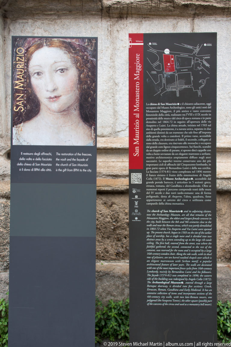 Two outdoor interpretive panels for San Maurizio, with a portrait detail, site diagram, and multilingual text.