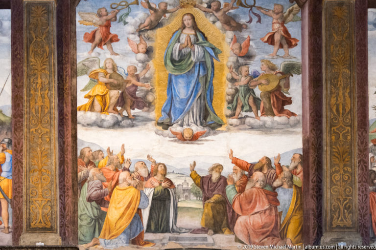 Vertical Assumption fresco with the Virgin rising among angels above apostles gathered around the tomb.