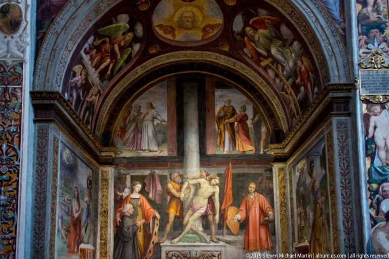 Frescoed chapel bay with the Deposition from the Cross at center and additional sacred scenes on the side walls and arch.