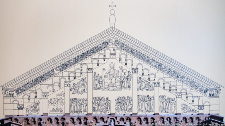 Line drawing of San Zeno west facade with rose window, gable arcading, portal, and sculptural relief fields.