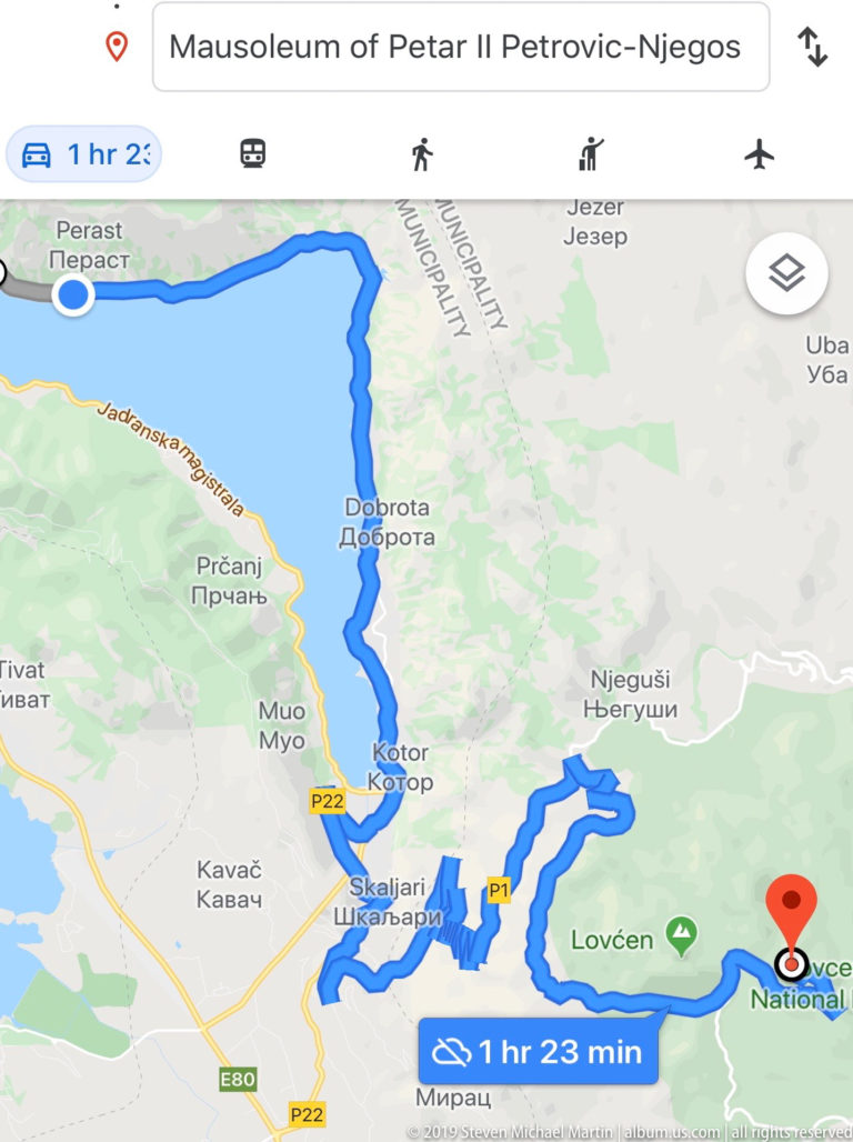 Regional digital map showing a blue route from the Bay of Kotor area through Njeguši and Lovćen toward the mausoleum.