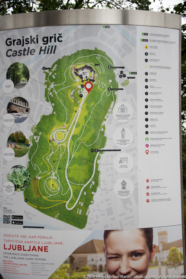 Visitor map of Ljubljana Castle and Castle Hill with paths, attractions, and access routes marked around the fortified summit.