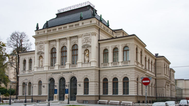 Oblique view of the National Gallery of Slovenia showing its ornate central pavilion and long side wing.