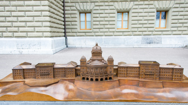 Wide view of a bronze architectural model showing the full Swiss Federal Palace complex in Bern.