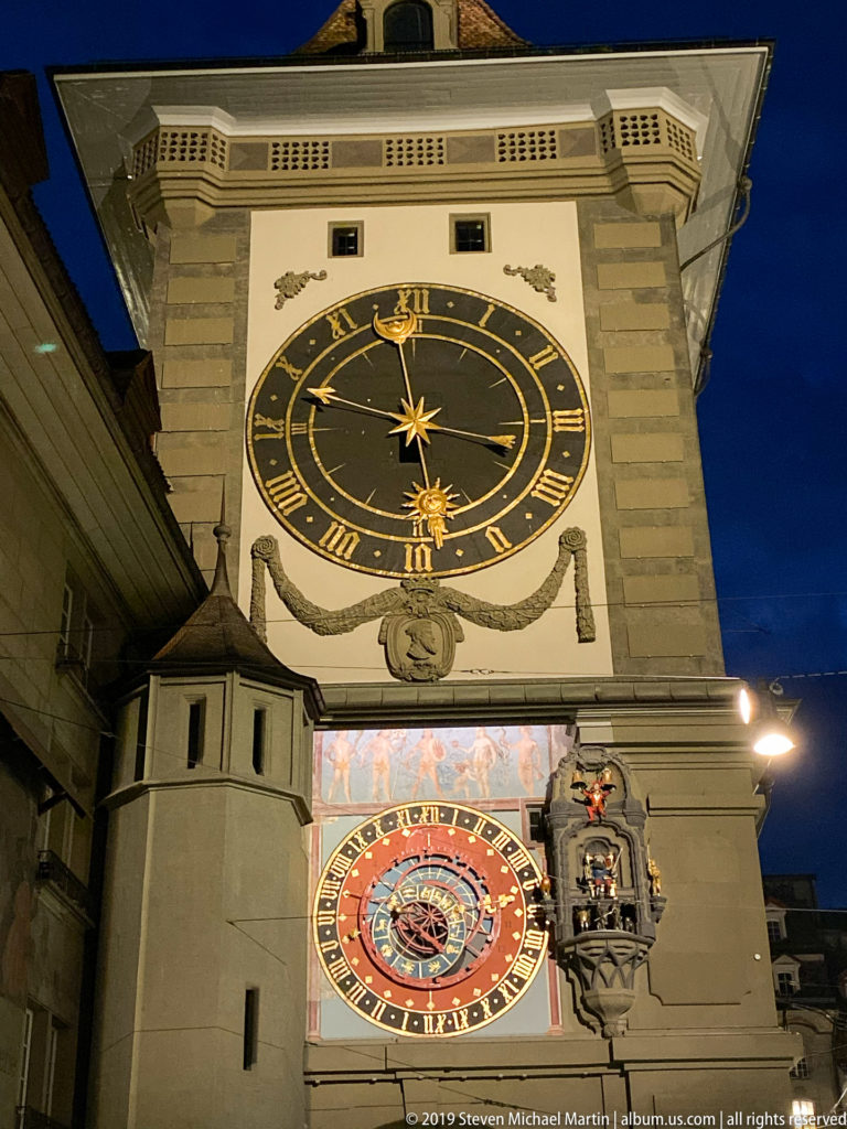Night view of Bern’s Zytglogge showing its large upper clock, astronomical dial, and projecting automata structure.