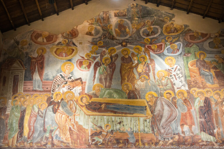 Large Dormition fresco with the Virgin on a bier, apostles gathered around, and Christ standing centrally behind.