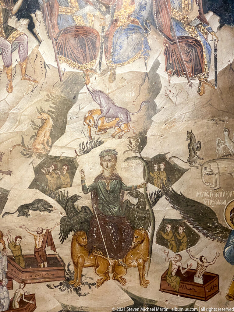 Crowned figure seated on a sea creature among boats, fish, animals, and resurrecting figures.