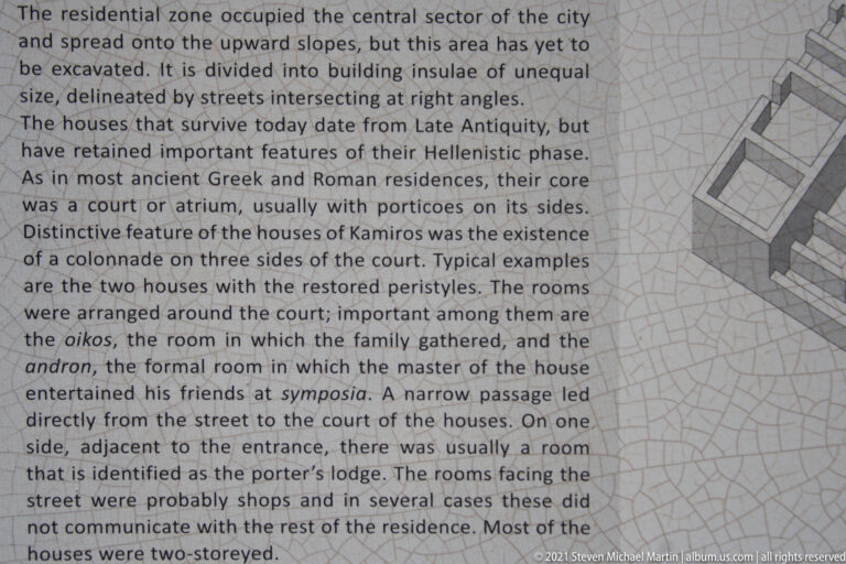Interpretive sign with English text about the residential zone and a schematic drawing of a courtyard house.