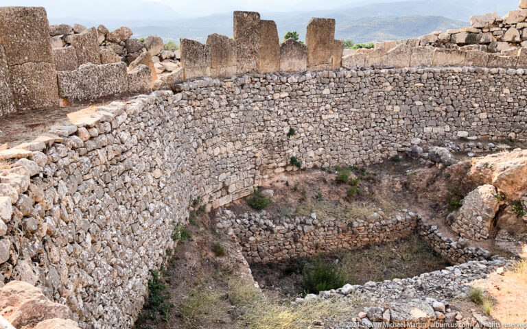 Curving stone enclosure of Grave Circle A at Mycenae surrounding the excavated shaft-grave precinct.