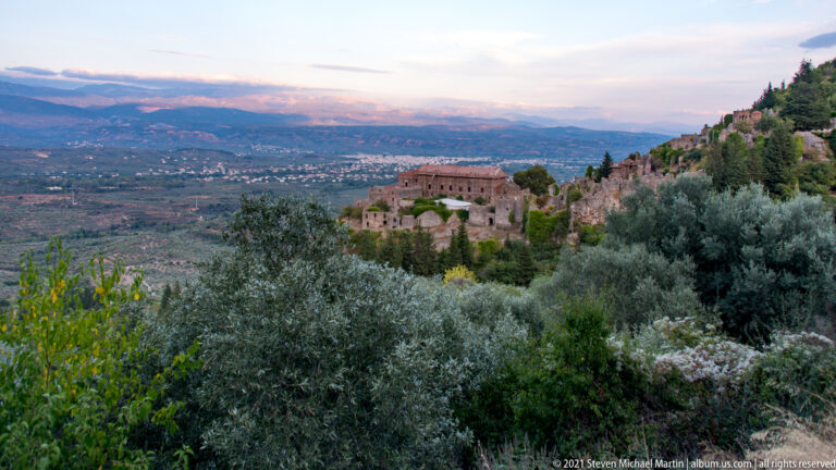 Palace of the Despots seen through olive trees above the broad Laconian plain at Mystras.