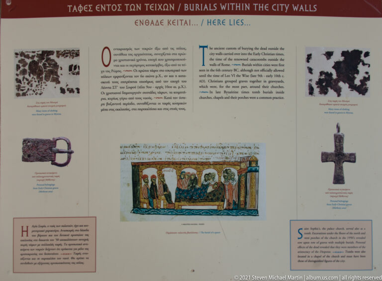 Bilingual interpretive panel at Mystras about burials within the city walls, with archaeological images, a plan, cross, and religious illustration.