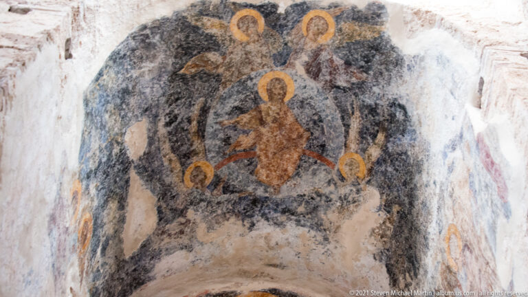 Fragmentary Byzantine fresco with a central haloed figure surrounded by several haloed figures in St. Sophia.