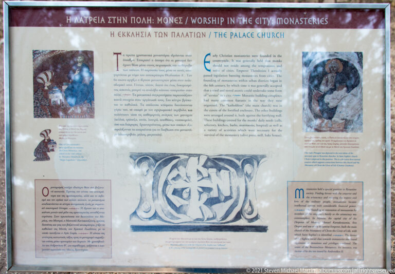 Bilingual interpretive panel at Mystras titled “Worship in the City: Monasteries” with a section on “The Palace Church.”