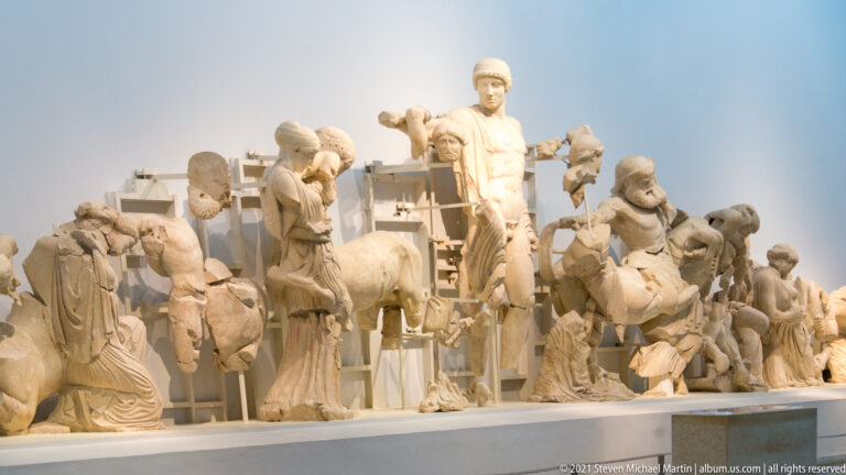 Oblique view of the Temple of Zeus east pediment, with marble figures from the Pelops and Oinomaos chariot-race myth.