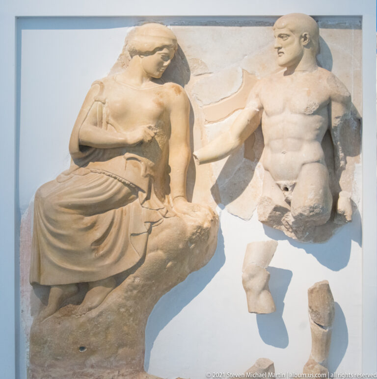 Fragmentary Temple of Zeus metope with nude Herakles beside the draped goddess Athena.