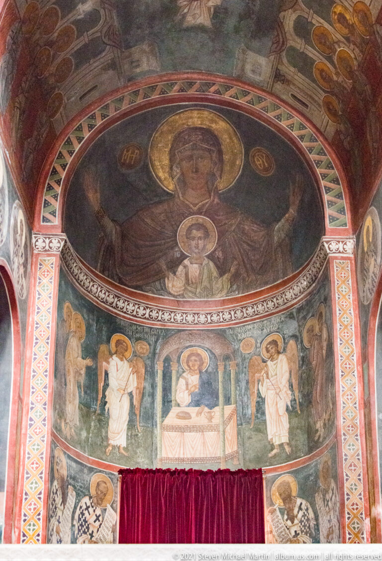 Apse frescoes in Panagia Kapnikarea with Virgin and Child above a liturgical scene and standing bishops.