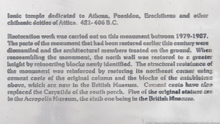 Close view of an English-language information panel describing restoration work on the Erechtheion and the treatment of original architectural members.