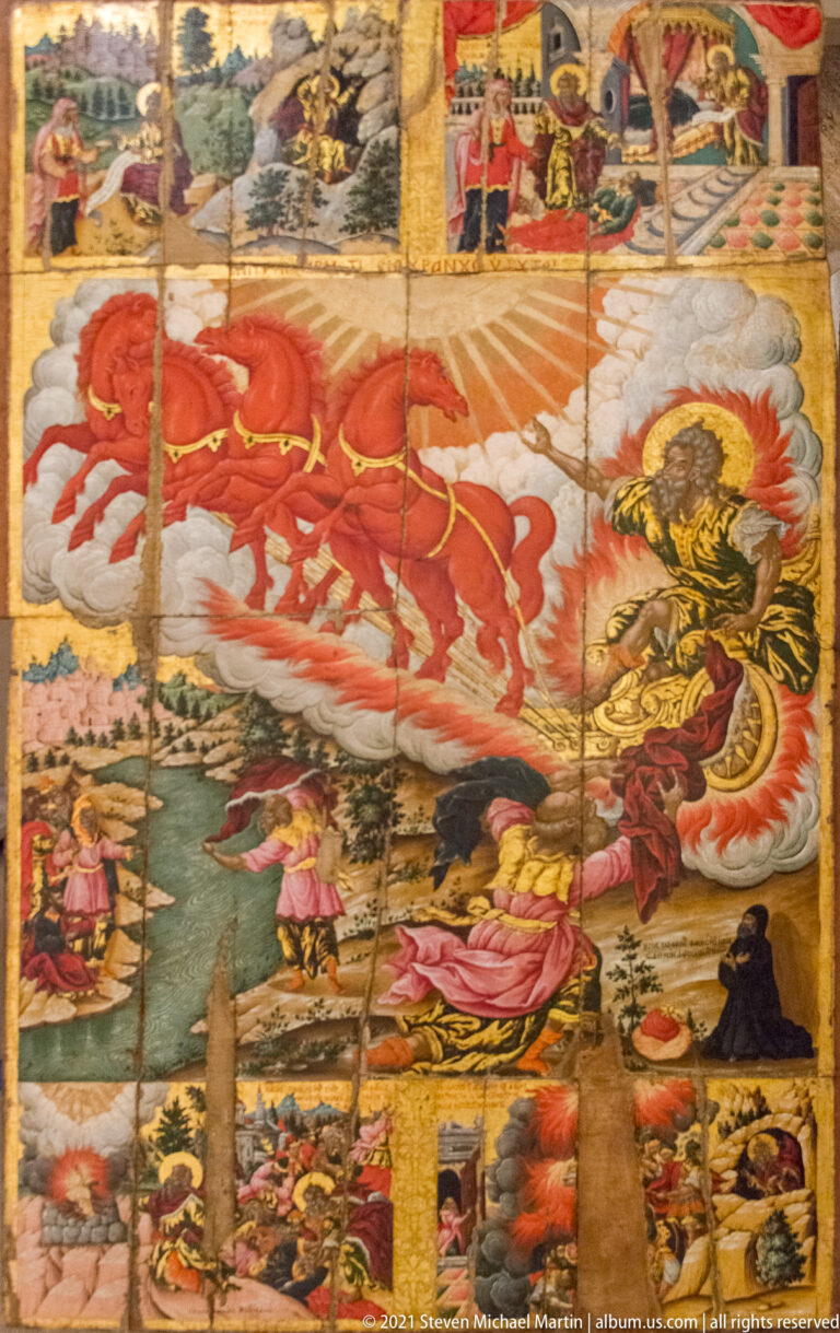 Multi-scene religious icon with a red mounted horse, dragon-like creature, landscapes, buildings, and smaller narrative episodes.