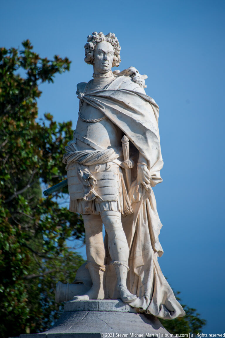 Carrara-marble statue of Schulenburg in Roman-style armor, toga, and laurel wreath beside Corfu’s Old Fortress.