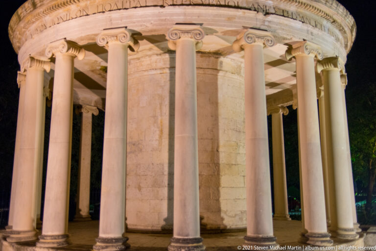 Curving row of Ionic columns around the cylindrical core of the 1816 Maitland Rotunda in Spianada Square.
