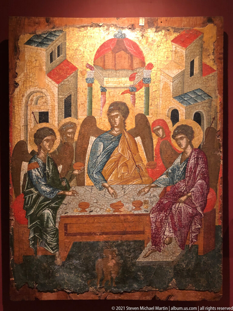 Last Supper icon with Christ and apostles gathered around a long table before stylized architecture.