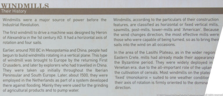 Close view of English interpretive text describing windmill history, development, classifications, and use in the Lasithi region.