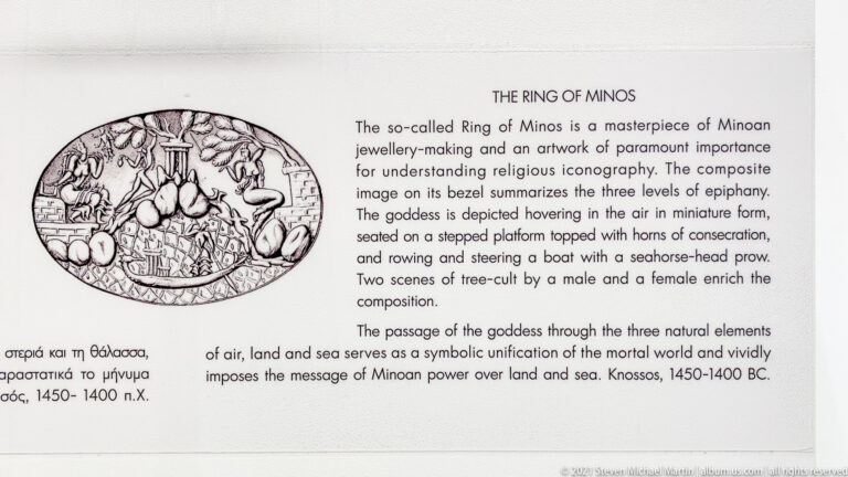 English museum label titled “The Ring of Minos,” with a drawing of the engraved bezel and an explanation of its religious scene.
