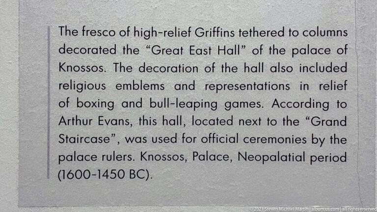 English museum text describing tethered high-relief griffins in the Great East Hall at Knossos and dating them to 1600–1450 BC.