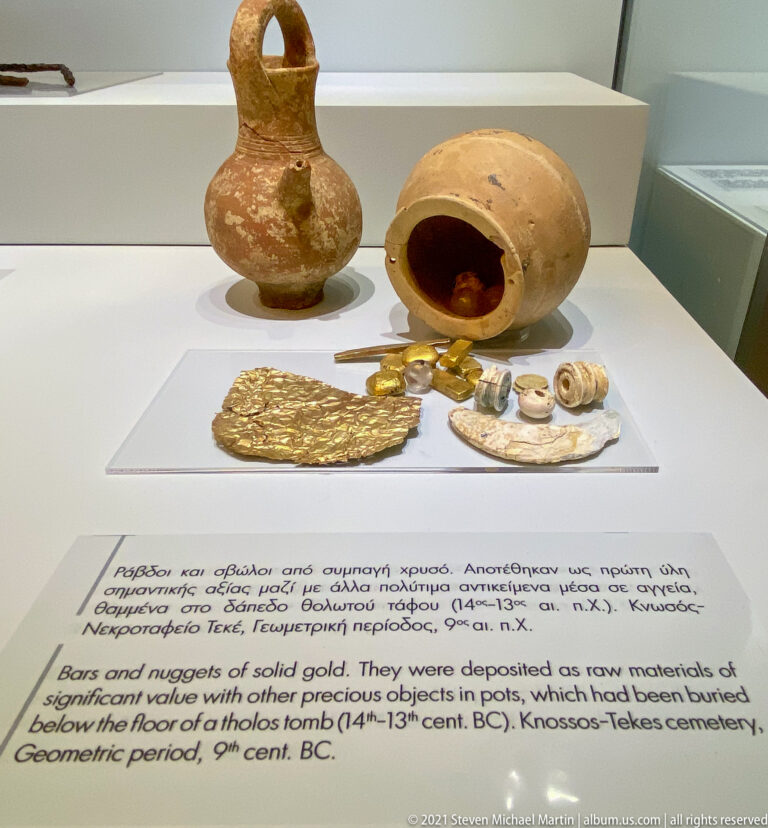 Two ceramic pots displayed with Byzantine gold solidi and other small precious objects from a concealed hoard at Gortyna.