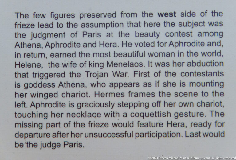 English museum text explaining the Judgment of Paris scene with Athena, Aphrodite, Hera, and Paris.