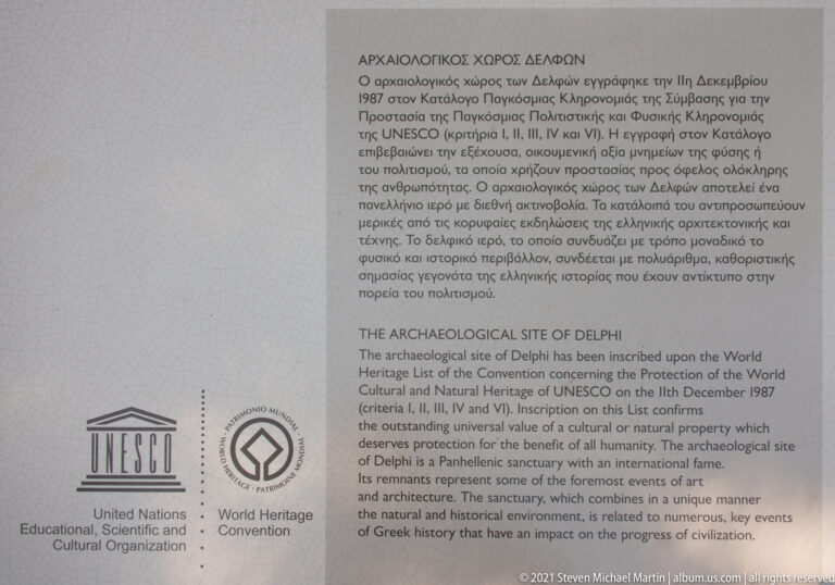 Bilingual UNESCO World Heritage information panel for the Archaeological Site of Delphi with official emblems.