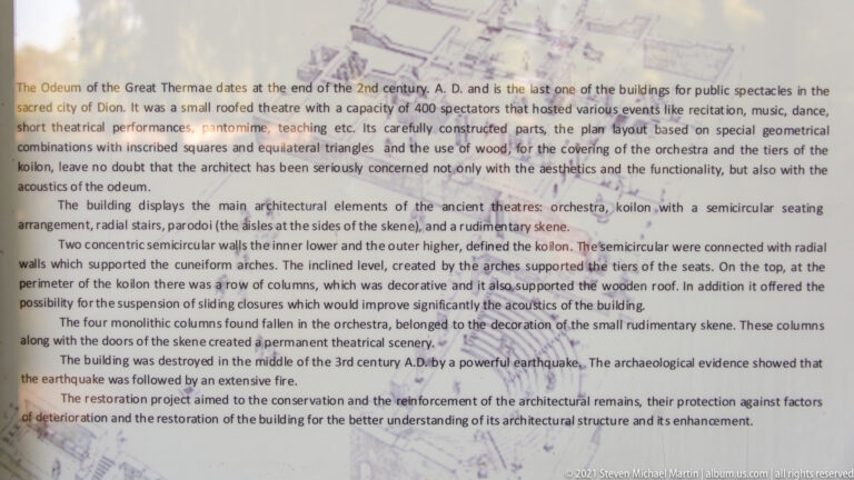 English interpretive panel describing the odeum’s architecture, earthquake destruction, conservation, and restoration.