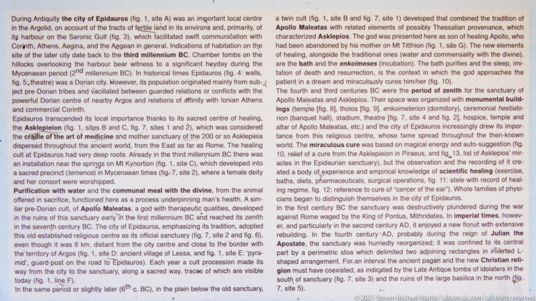 Close view of a densely printed English interpretation panel describing the history and sanctuary of ancient Epidaurus.