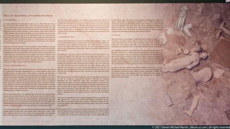 Museum panel with dense text and an excavation photograph of a human burial with artifacts exposed in the soil.