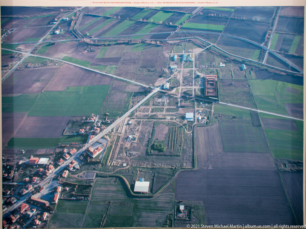 Aerial view of Pella’s excavated blocks and roads surrounded by rectangular agricultural fields.