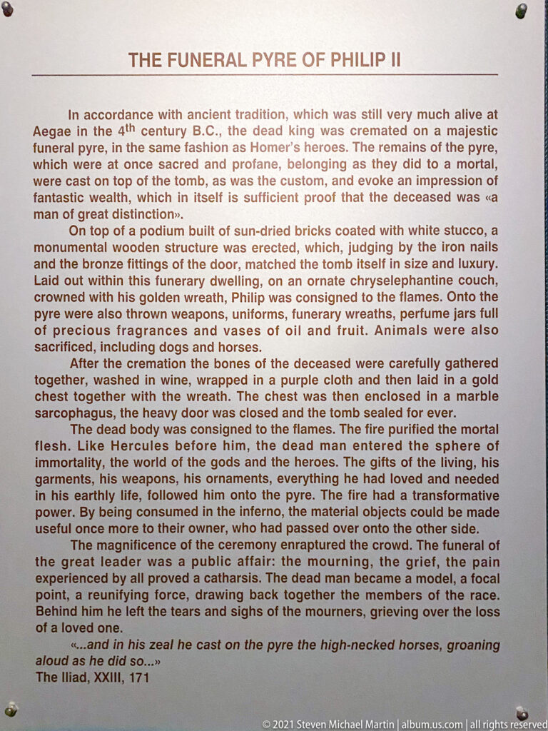 Museum panel titled “The Funeral Pyre of Philip II” explaining the king’s cremation and subsequent burial in Tomb II.