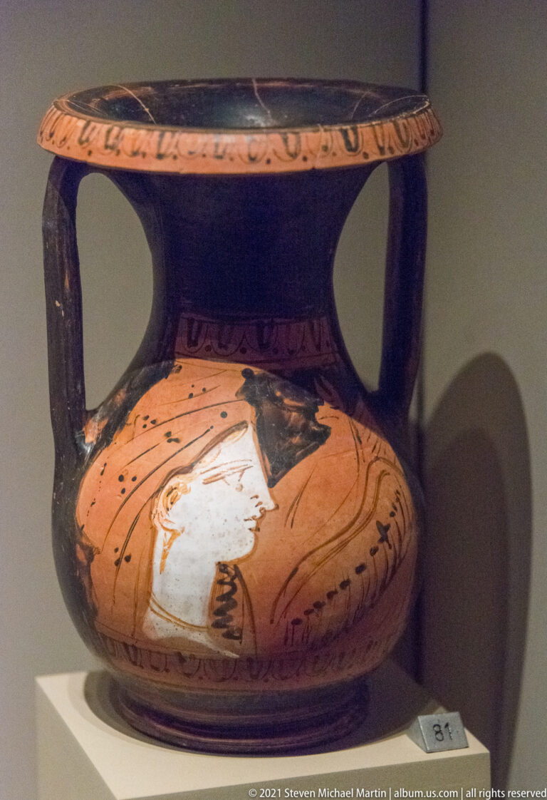 Two-handled red-figure vessel with a large white-highlighted human figure on the rounded body and black-glazed neck.