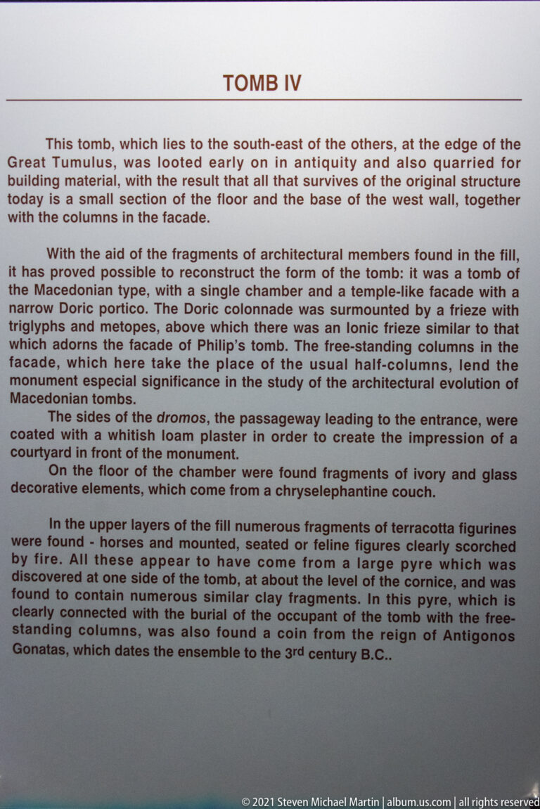 Museum interpretation panel headed “TOMB IV,” with dense text discussing the tomb’s architecture, decoration, and finds.