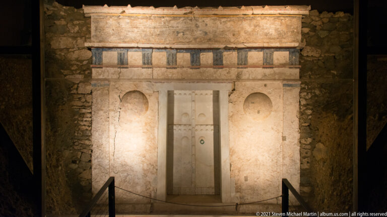 Frontal view of the Prince’s Tomb with central marble doorway and surviving painted architectural decoration.